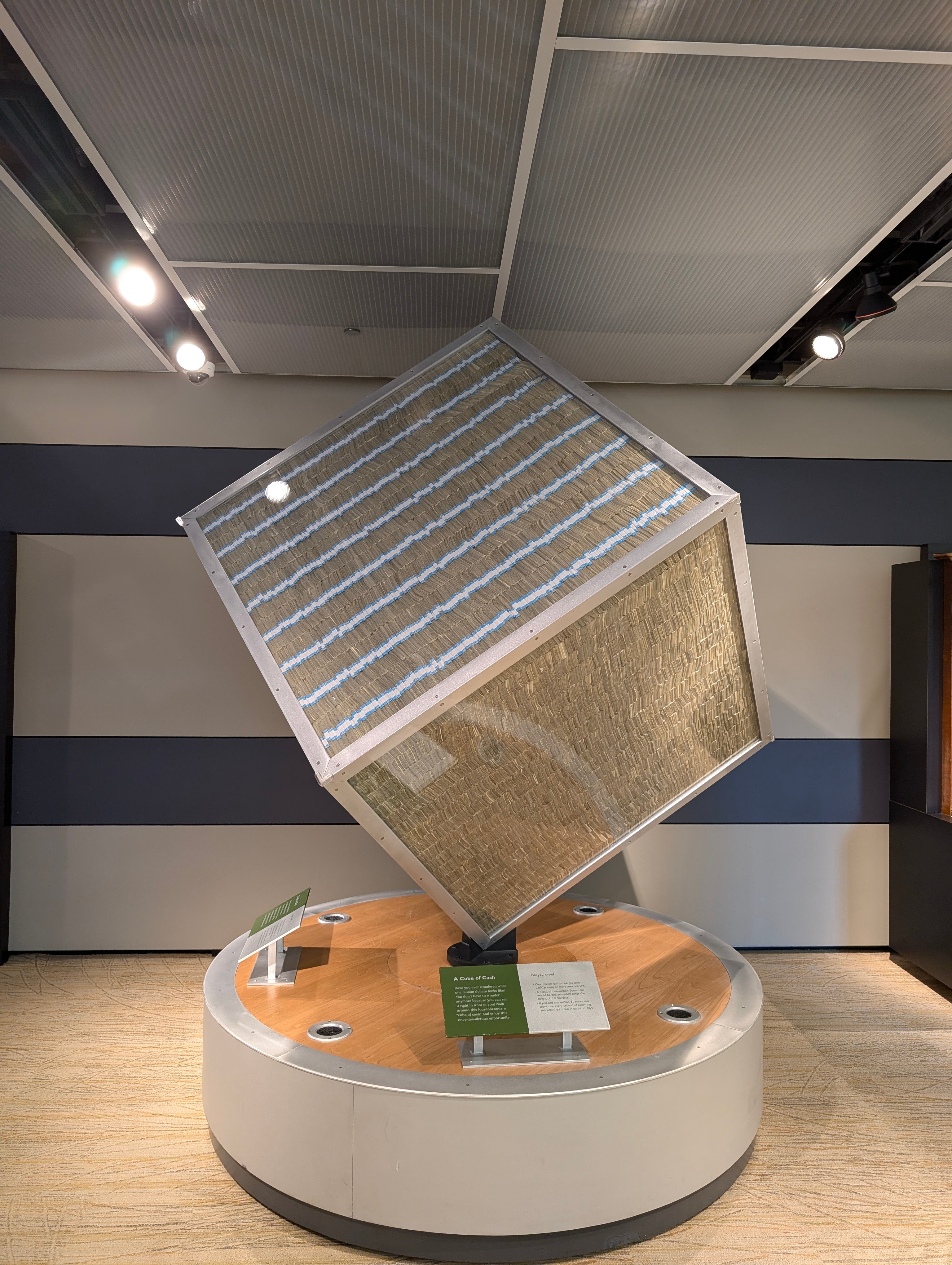 A large transparent cube filled with stacks of $1 bills is displayed at the Federal Reserve Bank of Chicago's Money Museum.